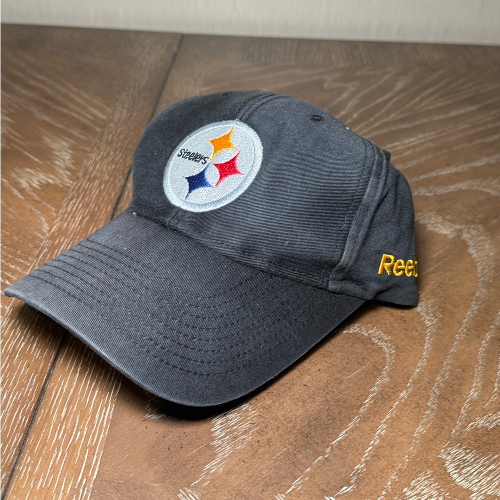 REEBOK PITTSBURG STEELERS STRAPBACK HAT. FADED BLACK NFL TEAM APPAREL ADJUSTABLE